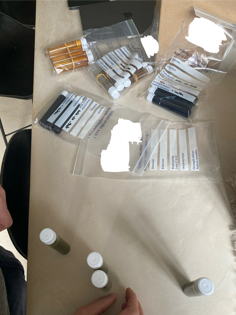 Behind the scenes at B.me: taste testing multiple liquid supplement formulas during early product development. Samples were evaluated for flavor, color, and ingredient combinations to refine the final blend.