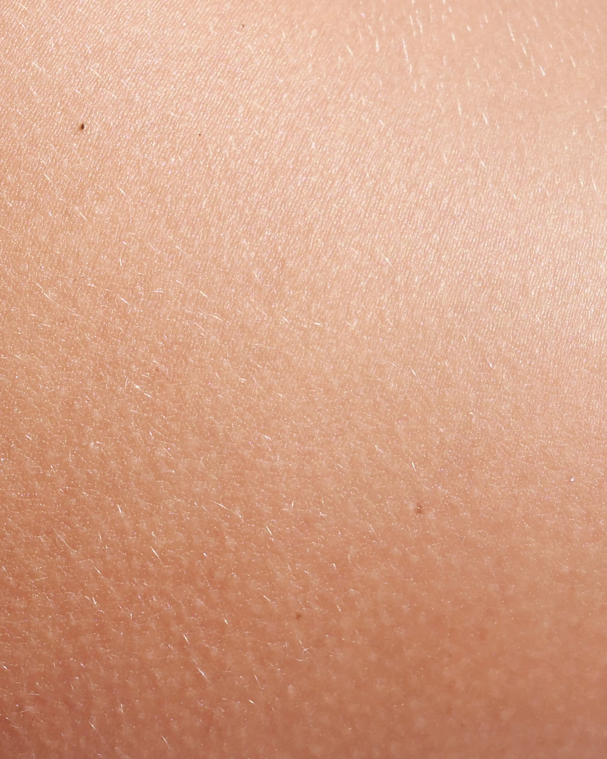 Close-up of healthy, natural skin texture under soft light — highlighting the results of skincare from within using B.me's scientifically formulated liquid supplements.